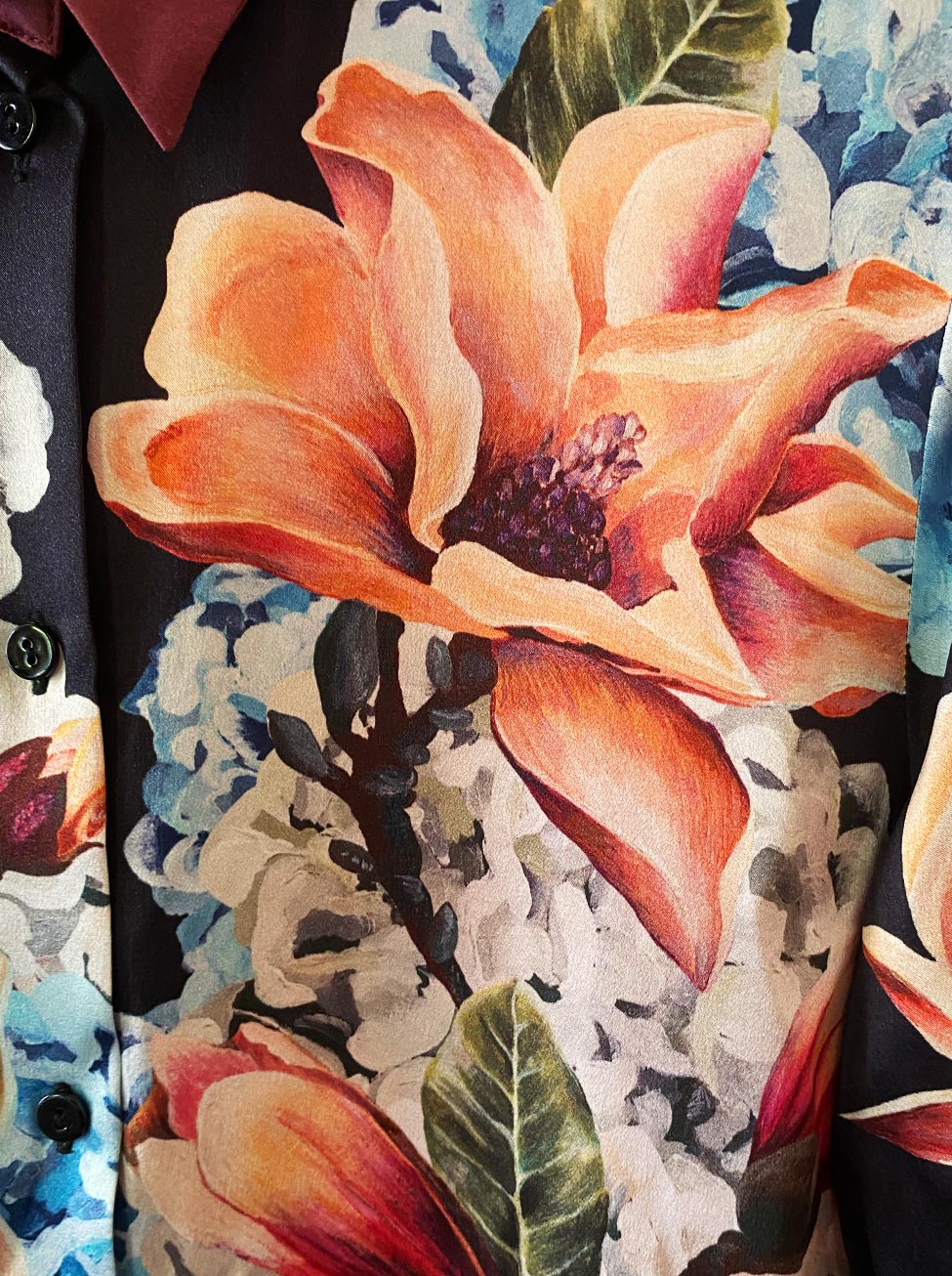 Close up of KAYLL silk shirt - hand painted print made in London of large scale florals